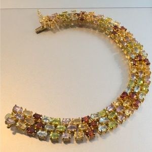 Amethyst, topaz, citrine, peridot, garnet multi stone tennis bracelet marked.